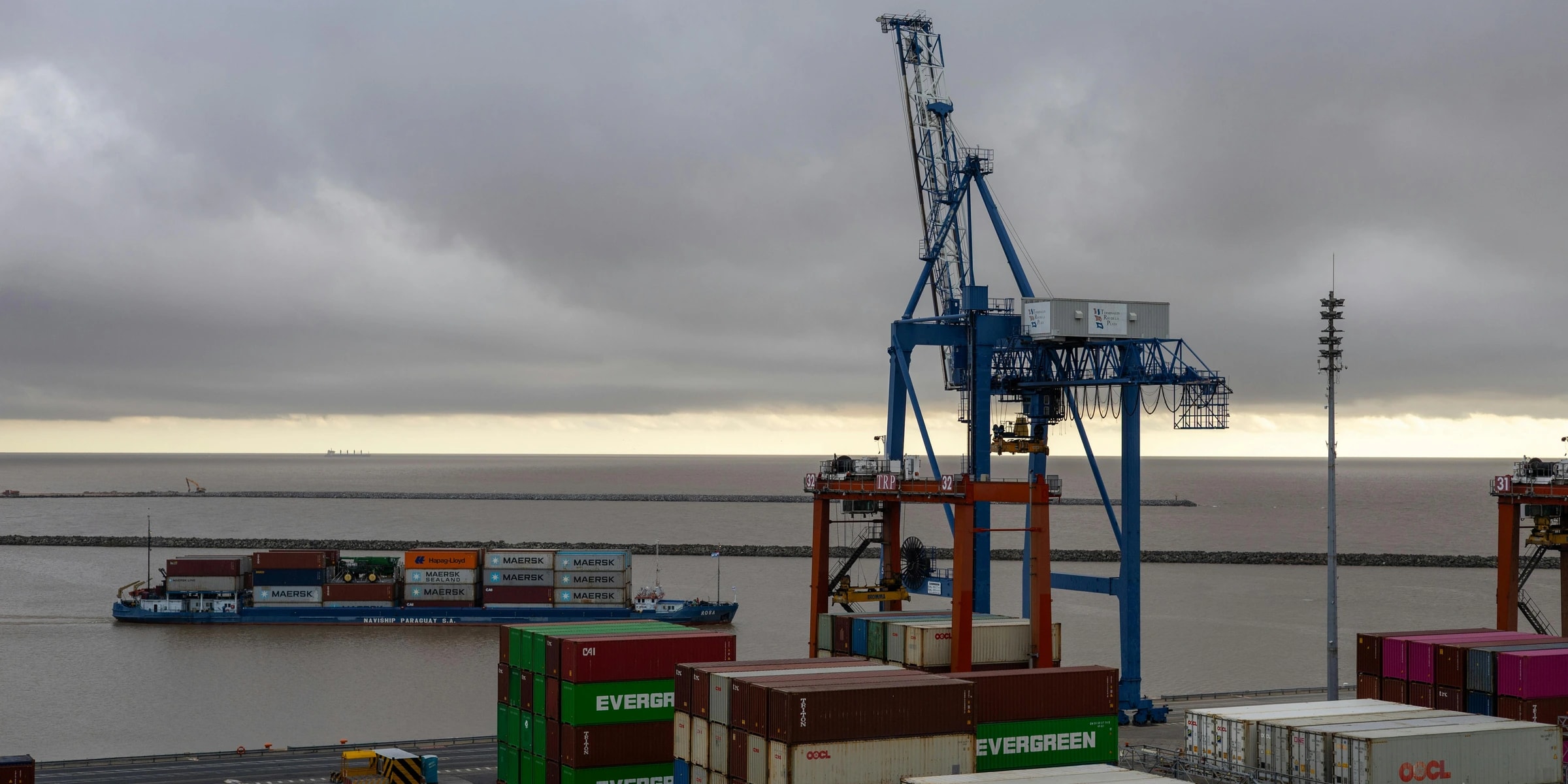 Industrial goods moving through a trade logistics route.