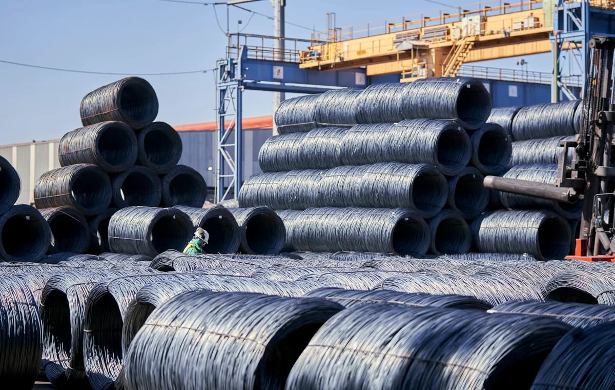 Coiled steel wire stored in an industrial yard before tariff and product-scope review.